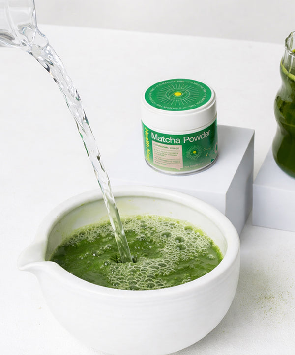 Then add the remaining 75 ml of hot water and continue blending to make a matcha espresso.